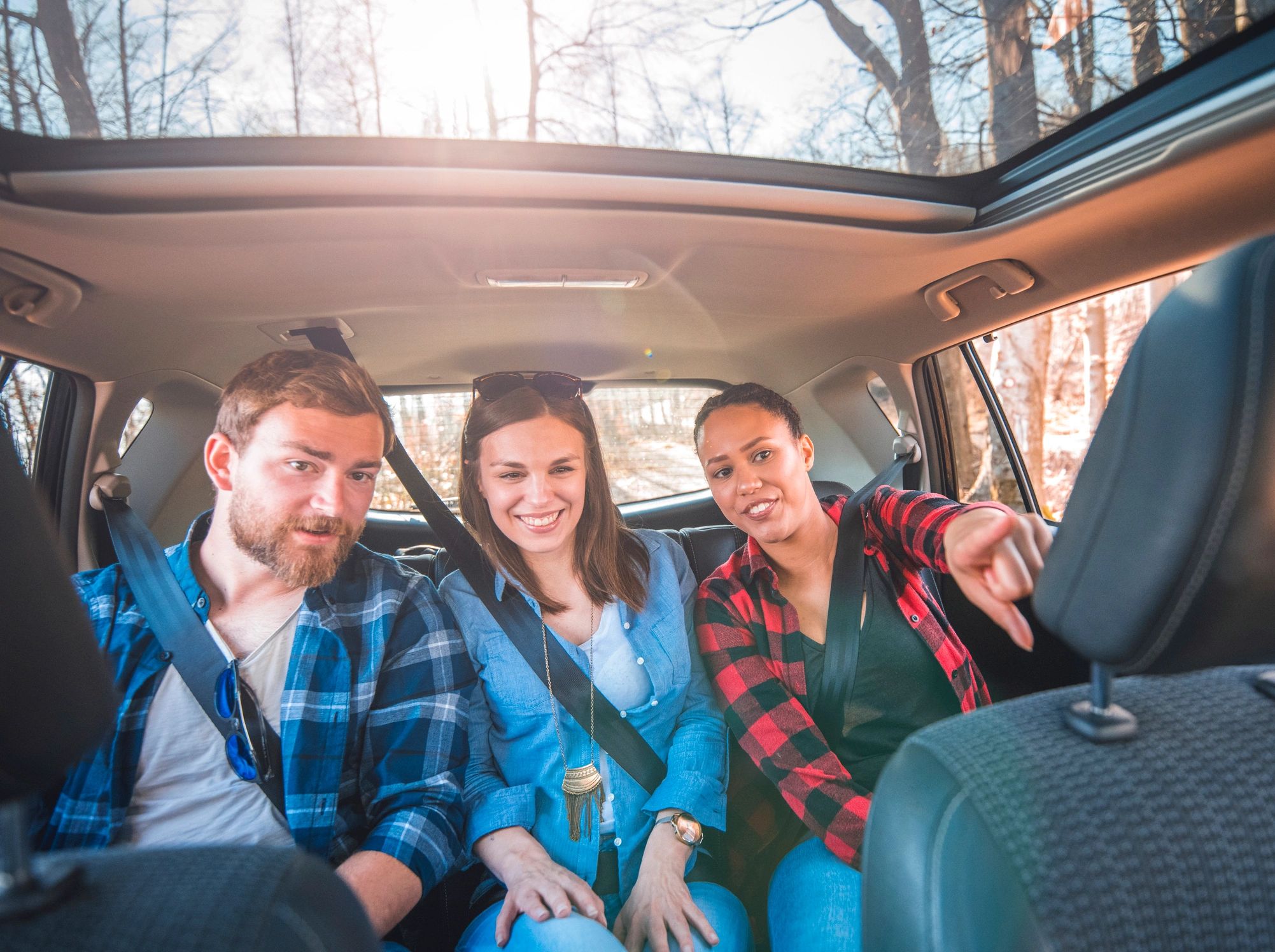 Happy passengers riding in a car