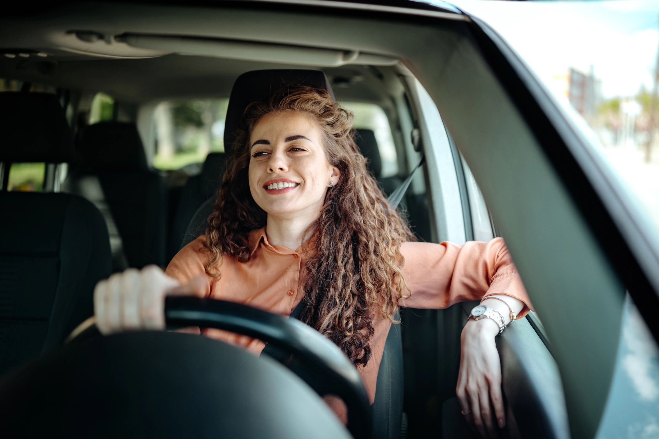 Driver in a modern vehicle representing new vehicle coverage